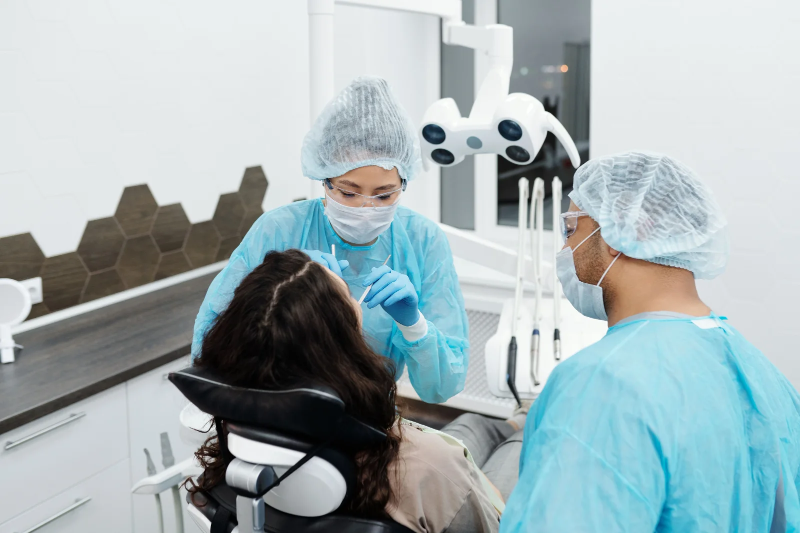 The clinical team treating a patient at Petőfi Dental in Budapest
